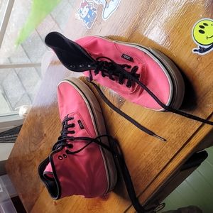 Neon pink Vans high tops